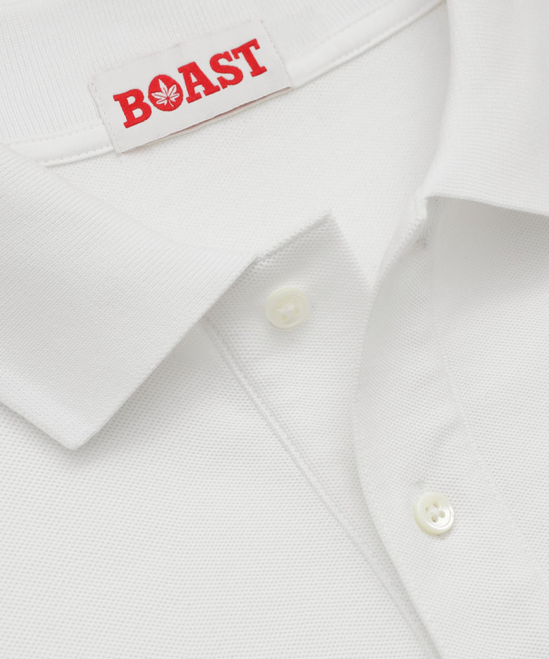 Polo in White with Green Leaf